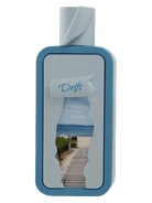 Riiffs Seasons Drift fragrance bottle with a beach scene visible through a torn label.