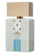 Giardini di Toscana Bianco Latte perfume bottle with a wooden cap and a label.