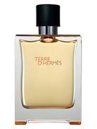 Terre d'Hermès Eau de Toilette bottle with orange liquid and black cap.