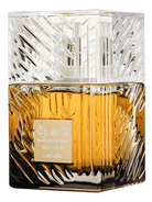 Lattafa Khamrah Qahwa Eau de Parfum bottle with gold fluted glass and clear patterned cap.