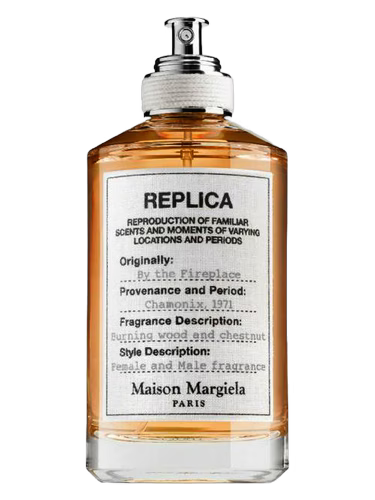 Maison Margiela Replica By the Fireplace Eau de Toilette bottle with orange liquid.