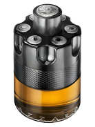 Azzaro Wanted By Night fragrance bottle designed like a revolver cylinder with amber liquid.